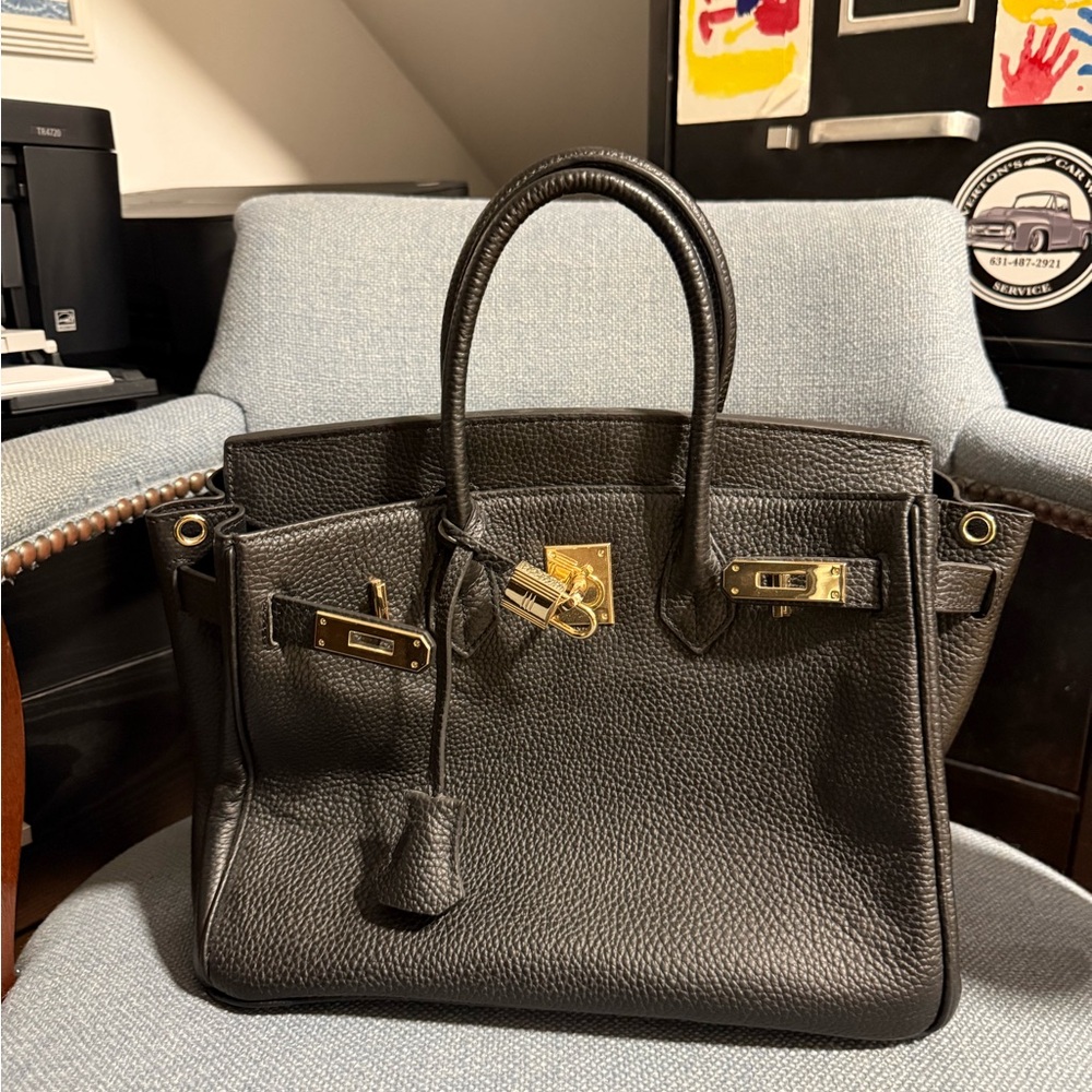 Women’s Black Leather Handbag with Gold Accents
